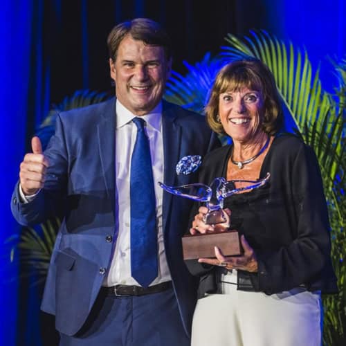 Ford Motor CEO Jim Farley presents "Spirit of Ford" award to Lyn St. James